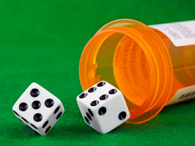 How AI Tools Stifle My Creativity and What I Learned - dice d6 falling out of a medicine tablet container orange
