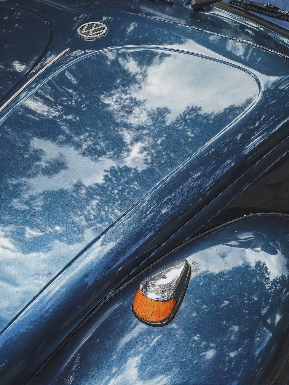 blue car with a shiny hood