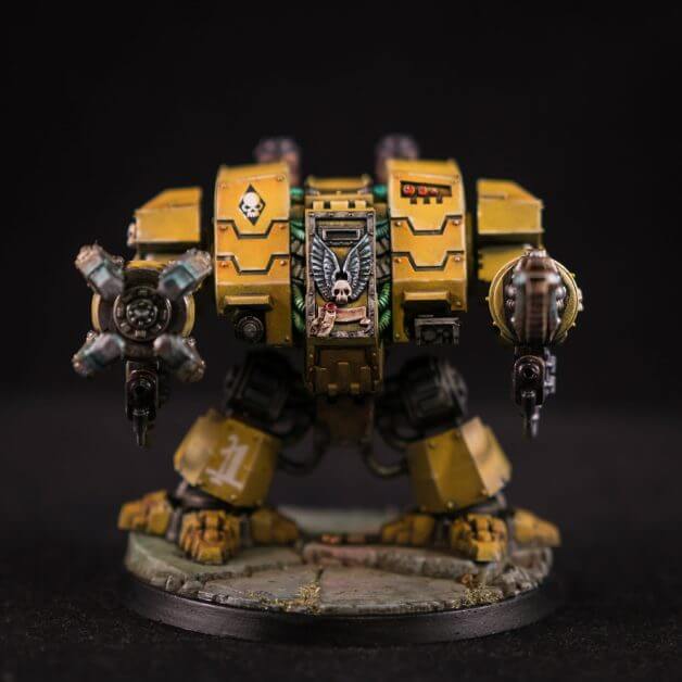 Imperial Fist Dreadnought - painted primarily Citadel Lysander yellow and photographed in a studio with a dark or black background