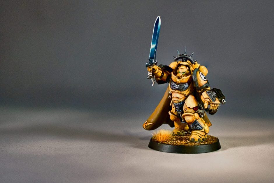 Painted Warhammer Space Marine miniature holding power sword with detailed highlights