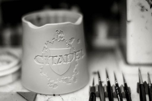 Citadel Water Pot Review: Good Buy or Not? - Citadel water pot recommendation - cleaning your brushes with games workshop citadel products - black and white product photo