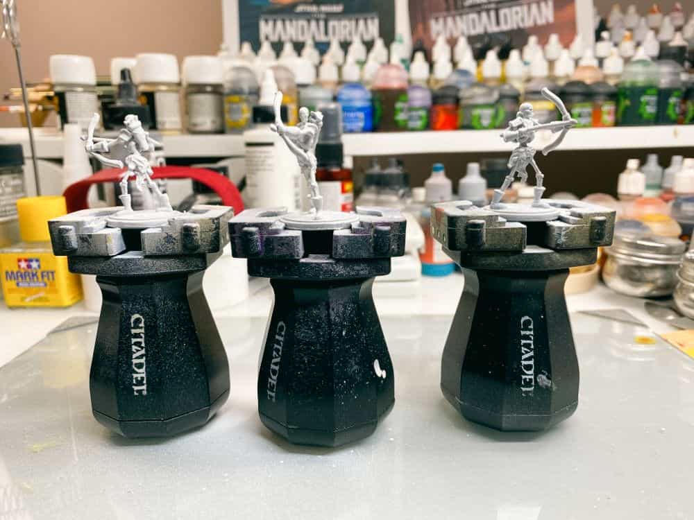 Games Workshop Painting Handles side by side with miniatures on them