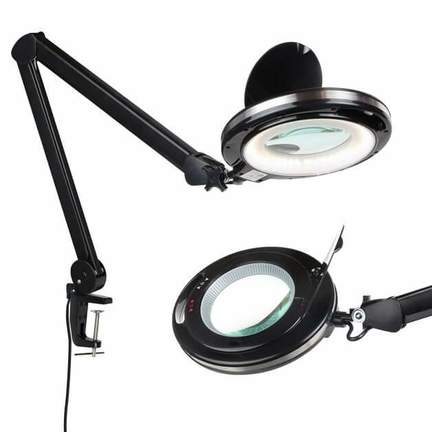 Swing-arm LED magnifier lamp mounted on a hobby desk

