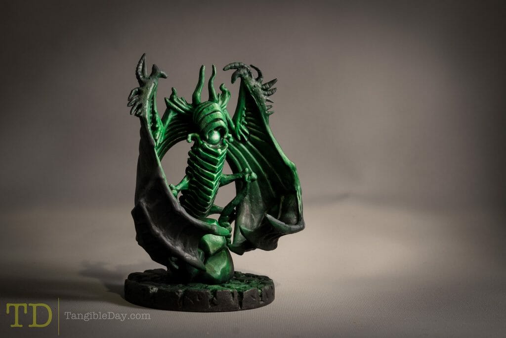 Cthulhu wars board game miniature with a matte varnish and photographed on a gray backdrop