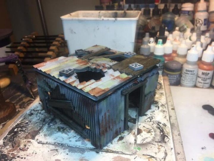 3 Awesome Ways to Make Wargaming Terrain (Cheap, Easy, and Free) - low cost cheap DIY wargaming terrain for Warhammer 40k, Age of Sigmar, and other tabletop games, DND terrain making, dungeon and dragon terrain for RPG - 3d printed shack and painted