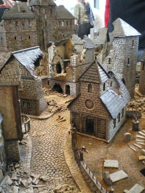 Miniature terrain for tabletop games depicting a medieval village.