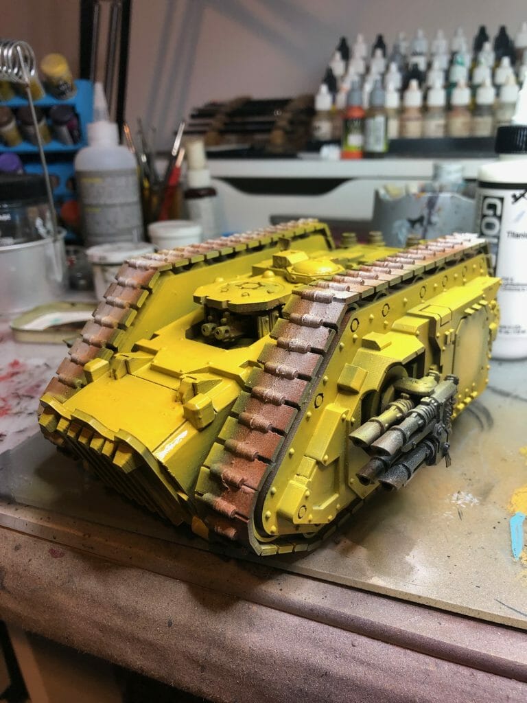 best airbrush paints for miniatures and scale models - basecoating a tank with an airbrush - example from warhammer 40k model