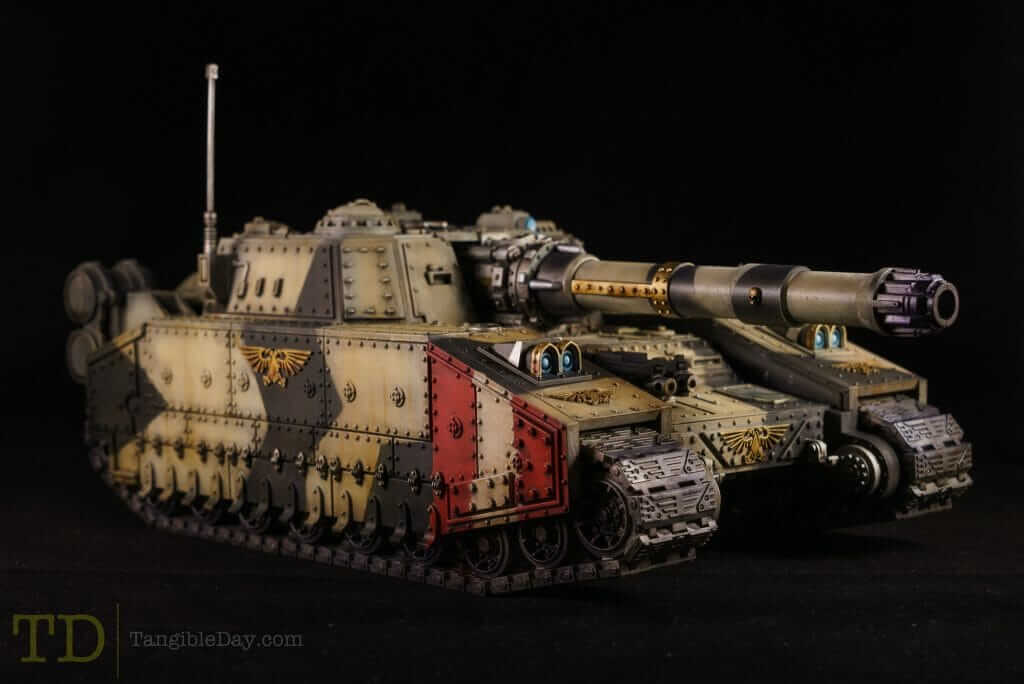 Shadowsword Astra Militarium Tank warhammer 40k - An expertly painted armored tank miniature in a dark setting, displaying weathering effects and battle insignias.