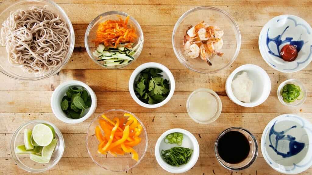 Various ingredients laid out for preparation, showcasing a mise en place setup