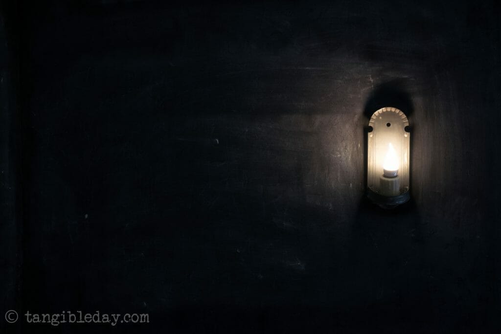 It's okay to be like a child - introspective thoughts on a road trip - lamp on black wallpaper