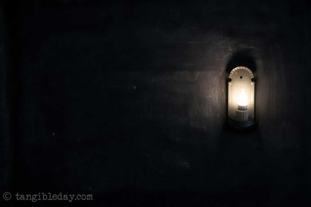 It's okay to be like a child - introspective thoughts on a road trip - lamp on black wallpaper