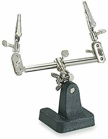 Basic helping hands tool with two adjustable alligator clips on a metal stand for miniature assembly.