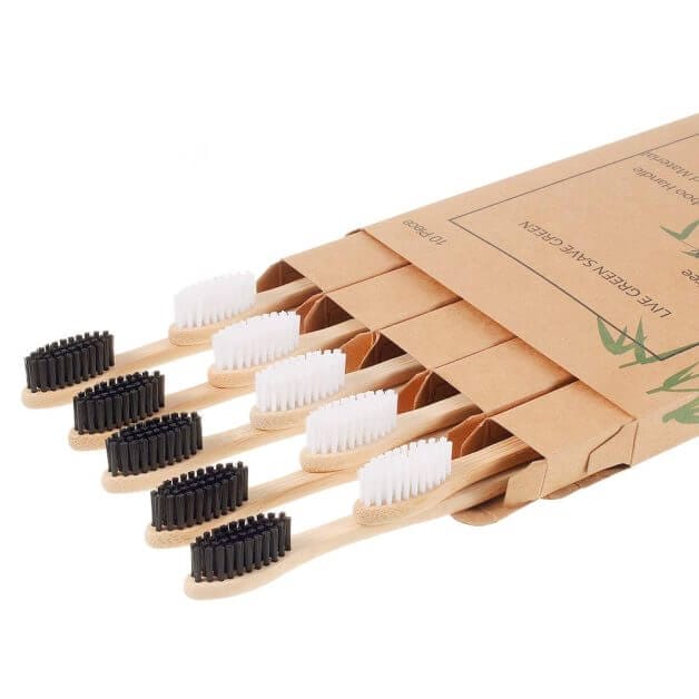 A pack of eco-friendly bamboo toothbrushes with black and white bristles, indicating the use of sustainable products in the hobbies and modeling community.