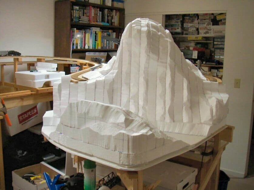 Large foam mountain terrain carved with stepped hot wire cuts