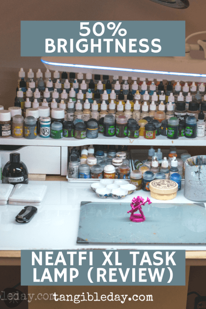 50% brightness example of the neatfi xl lamp over a hobby desktop