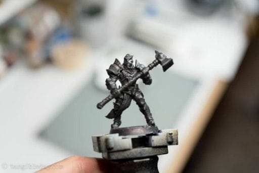 How to use an airbrush to paint zenithal highlights and shadows. Airbrush zenithal highlights on models and miniatures. Painting miniatures with an airbrush for fast, easy contrast. Tutorial for spraying zenithal highlights, a trick for speed painting. Miniature painting tricks, tips and tutorials. Dark, black or gray primer applied to the model.