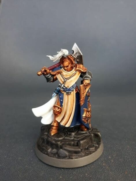 Stormcast Eternal Paint Schemes - 9 Color Motifs - how to paint stormcast eternals - color schemes for stormcast eternals, liberators, celestants, and other Age of Sigmar models from the Stormcast Eternal range - 9 color schemes for Stormcast Eternal models and miniatures from Citadel Games Workshop - a very orange gold armor with blue accent sequitur