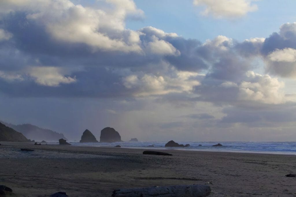 Bad weather photography ideas - landscape photography in bad weather -landscape photos in the rainy weather - landscape photography in the rain - rain photography ideas - overcast landscape photography - how to take better photos in bad weather - picture of Cannon beach in Oregon