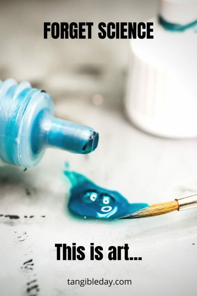 Blue paint and a paintbrush on a palette, portraying the balance between artistic expression and technical skills.