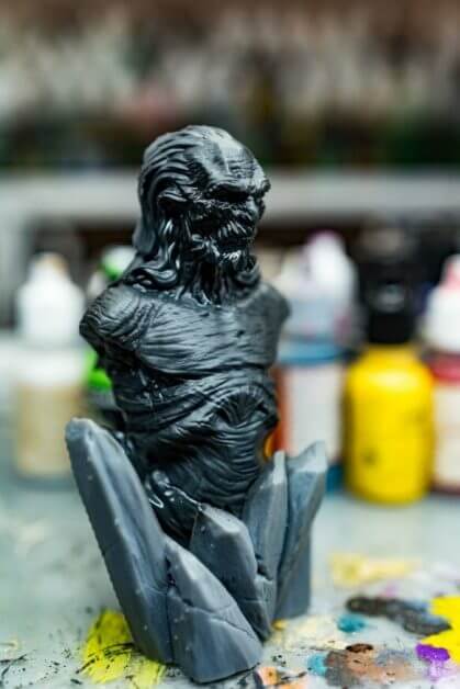 Primer drying on 3D printed miniature, dark gray color