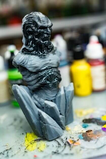 3D printed Game of Thrones bust with primer brushed on and airbrushed example