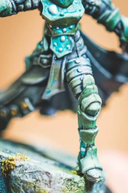 Close-up of inked armor details on miniature figure