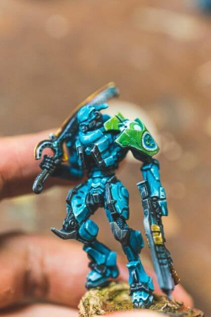 Miniature Painting Tips for Beginners - tips for beginner miniature painters - painting miniatures for beginners - an blue infinity miniature model I painted