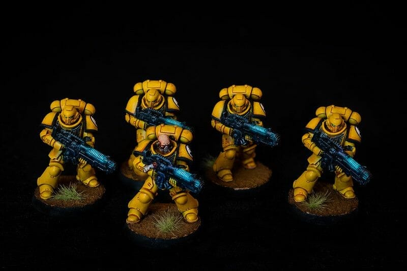 Understanding Acrylic Paint for Miniature Hobbies: Uses, Types, and Best Picks (Guide) - Space Marines Imperial Fists in yellow and glowing plasma weapons