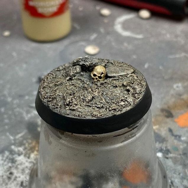 My Favorite Citadel Technical Paint and How to Use Astrogranite Debris (Review) - citadel texture paint astrogranite review and tutorial - miniature base finished with citadel technical paint skull visible