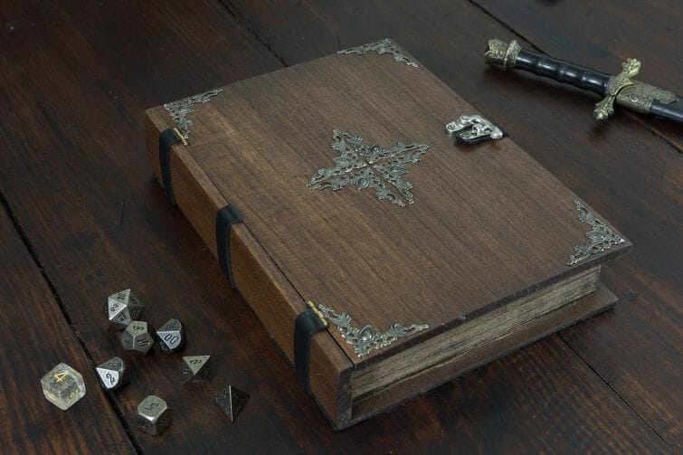 13 Cool Dice Trays for Tabletop Games – best dice trays for wargaming – Warhammer dice tray and storage – best dice tray for Warhammer 40k and miniature games – boardgame dice tray – best dice trays – dice trays for dungeons and dragons, D&D, and roleplaying games (RPG) – Spell Book Dice Tray Box with Metal Accent
