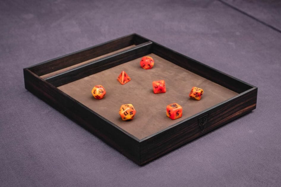Is a Dice Tray Worth it? The Ultimate Dice Tray Guide - are dice trays worth it? - What you need to know about dice trays - black wooden tray with orange dice