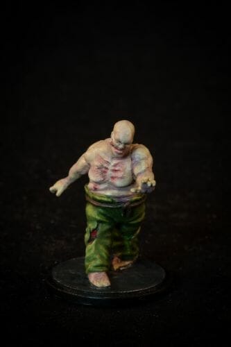 Painting a zombie RPG miniature with oil paints - painting RPG miniatures - oil painting miniatures - origin miniatures - how to paint rpg miniatures - how to paint dungeon and dragons miniatures - painting miniatures and models for role playing games - oil painting 28mm miniatures - front photo