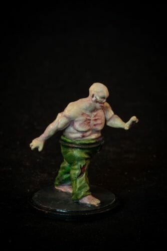 Painting a zombie RPG miniature with oil paints - painting RPG miniatures - oil painting miniatures - origin miniatures - how to paint rpg miniatures - how to paint dungeon and dragons miniatures - painting miniatures and models for role playing games - oil painting 28mm miniatures - side photo