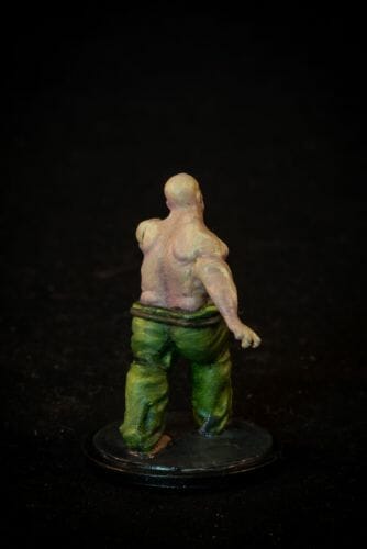 Painting a zombie RPG miniature with oil paints - painting RPG miniatures - oil painting miniatures - origin miniatures - how to paint rpg miniatures - how to paint dungeon and dragons miniatures - painting miniatures and models for role playing games - oil painting 28mm miniatures - rear view photo