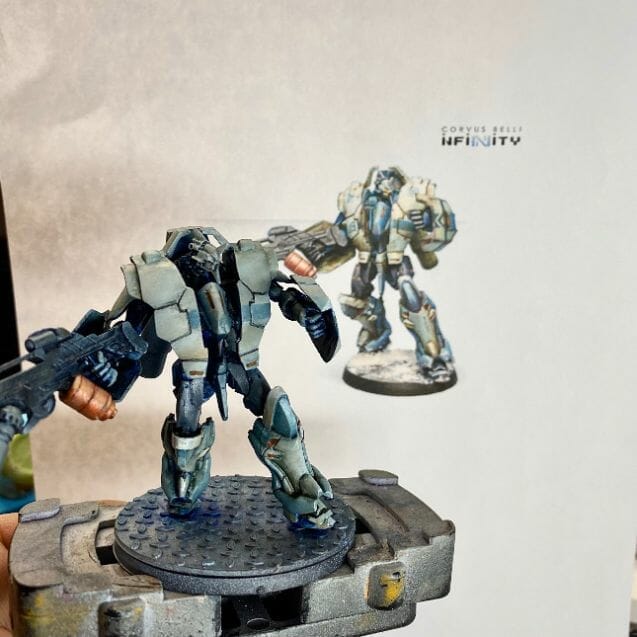Miniature Painting Tips for Beginners - tips for beginner miniature painters - painting miniatures for beginners - an Infinity TAG painted using concept art as a reference