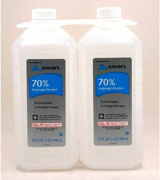 A bottle of rubbing alcohol used as a strong, fast-evaporating thinner for acrylic miniature paints.