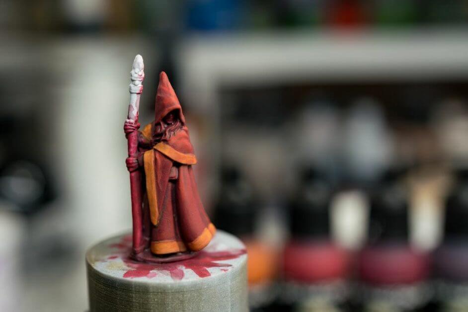 reaper mage miniature work in progress with red and orange paint layers dried matte 