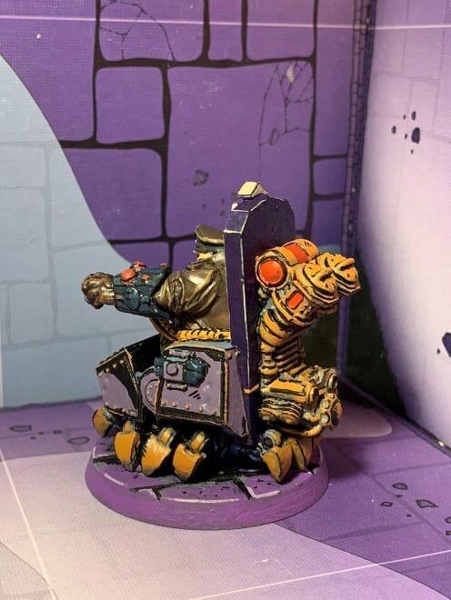 painting comic book miniatures - how to paint comic style miniatures - cel shaded miniature painting – how to paint cel shaded miniature – cell shaded miniature painting – miniature painting styles – how to paint cell shaded – borderlands miniature painting style – comic style painting - side shot model of inked miniature