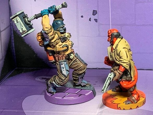 Painting comic book miniatures - how to paint comic style miniatures - cel shaded miniature painting – how to paint cel shaded miniature – cell shaded miniature painting – miniature painting styles – how to paint cell shaded – borderlands miniature painting style – comic style painting - cel shaded comic miniature painting - Übersoldaten from Reichbusters faces off against Hellboy