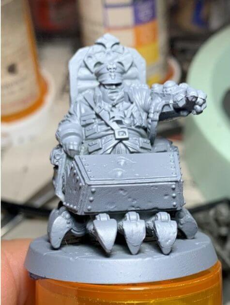 painting comic book miniatures - how to paint comic style miniatures - cel shaded miniature painting – how to paint cel shaded miniature – cell shaded miniature painting – miniature painting styles – how to paint cell shaded – borderlands miniature painting style – comic style painting - general wolff miniature from reichbusters board game