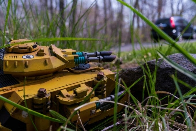 What is "Learned Helplessness"? Insights for Artists - close up low perspective of a yellow painted Warhammer scale model 40k tank