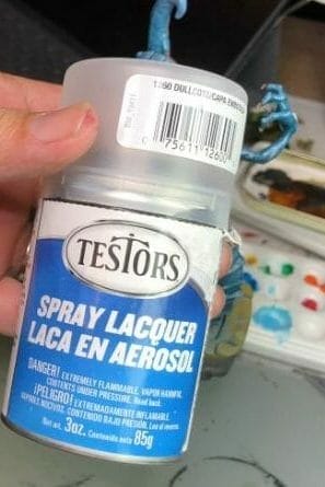 A hand held can of testors dullcote spray 