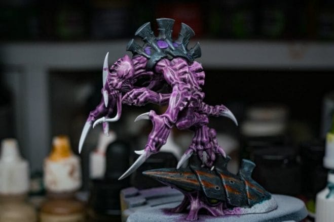 Top 10 Primers for Plastic and Metal Miniatures (Reviews and Tips) - best primer for plastic, metal, or resin miniatures and models. Purple tyranid model with main color base