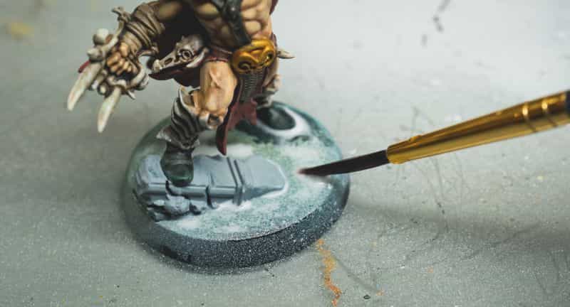 Three creative ways to use varnishes on painted miniatures - miniature painting varnish use - fun ways to use clear coat varnishes on miniatures and models - Applying varnish to a base as a glue.