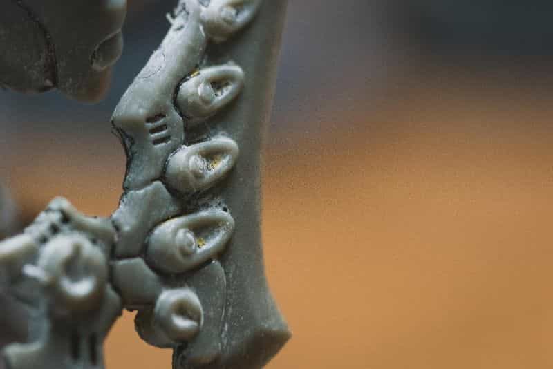 Top 3 Mistakes To Avoid When Priming Miniatures and Solutions - tips for resolving and fixing primer issues on models - stripped close up model plastic surface