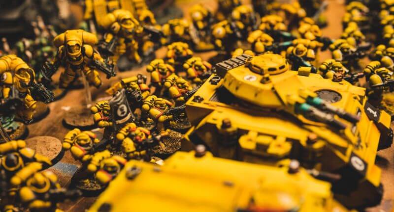 Understanding Acrylic Paint for Miniature Hobbies: Uses, Types, and Best Picks (Guide) - What is acrylic paint, it's uses, and best types - A yellow painted warhammer 40k space marine army