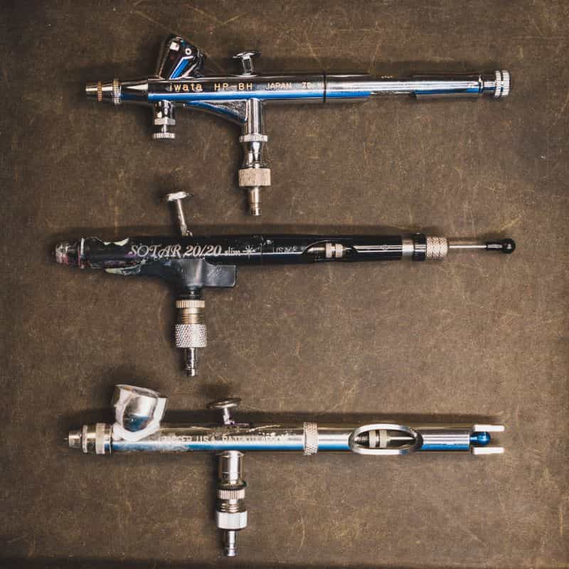 Best Miniature Painting Lamp for Professional Use (A Commission Painter's Review) - best pro miniature painting lamp - miniature painting lamp for professional use - airbrush tool lined up top down