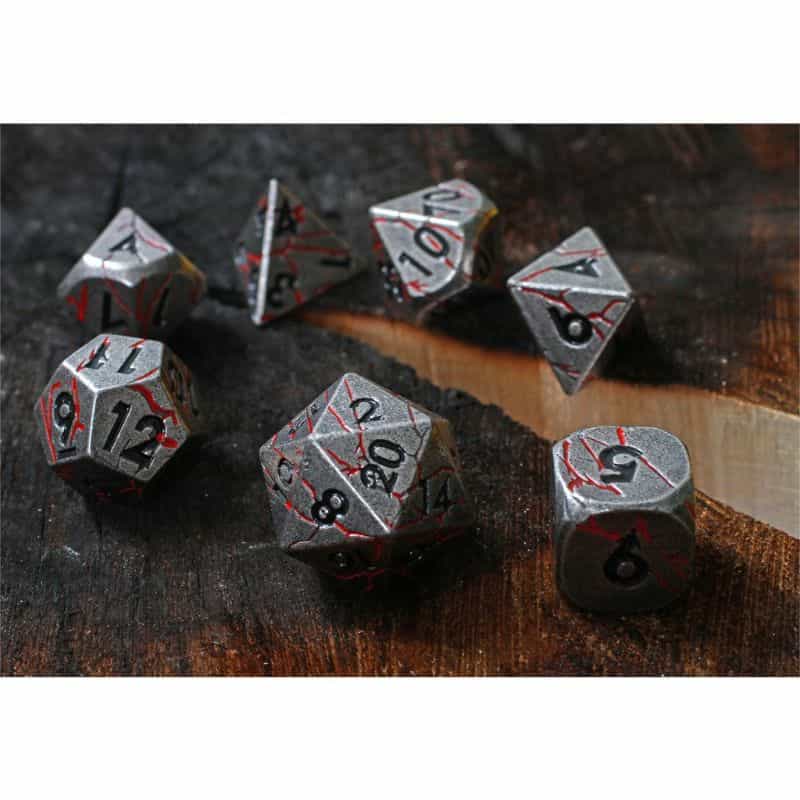 Forged Gaming metal dice with cracked red motif on gun metal steel color