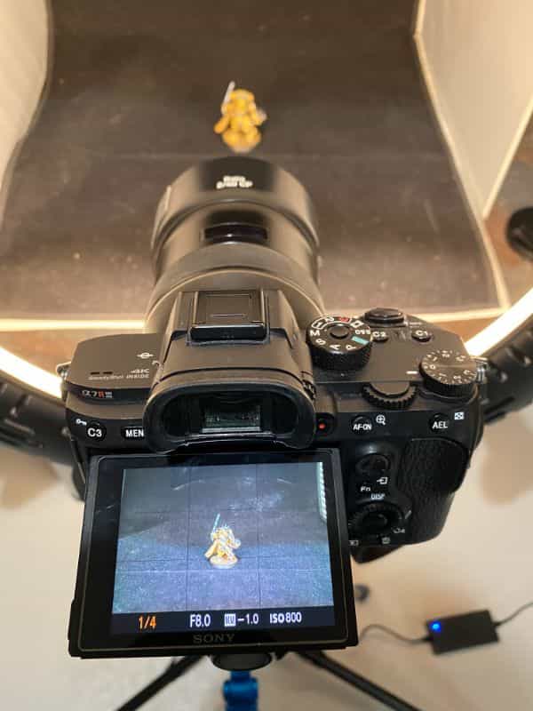 How to Photograph Miniatures with a Black Background (Guide) - how to capture miniature photos with pure black backdrops - infinite black backgrounds in miniature and model photography - guide for pure black background miniature photography - composing image