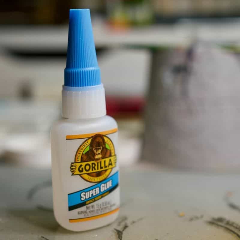 How to Prepare Miniatures for Paint - Quick start guide to assembling and preparing models for painting - bottle of super glue gorilla brand